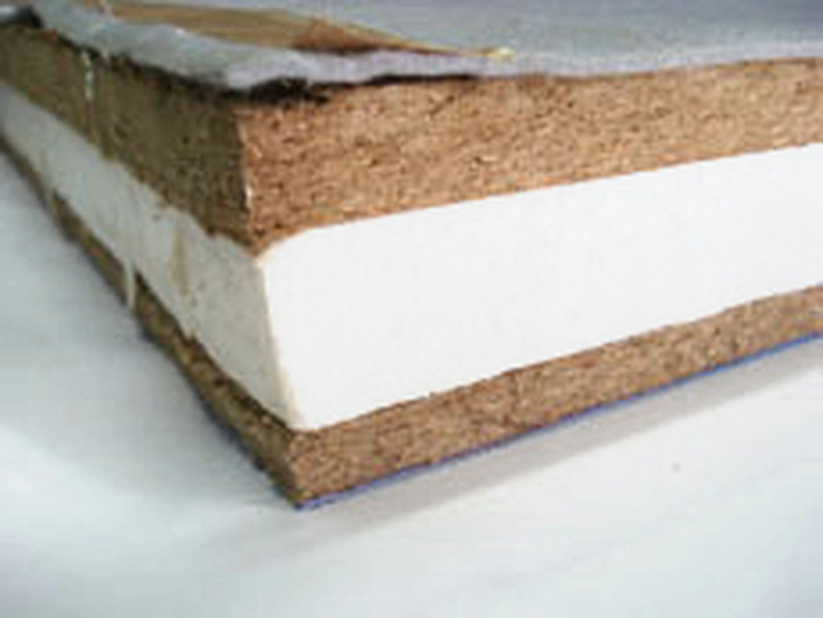 Cross section of a tatami core with a white layer between pressed fiber